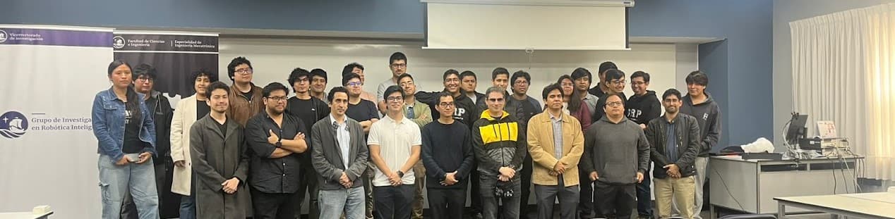 A diverse group of students working together on a robotics project.